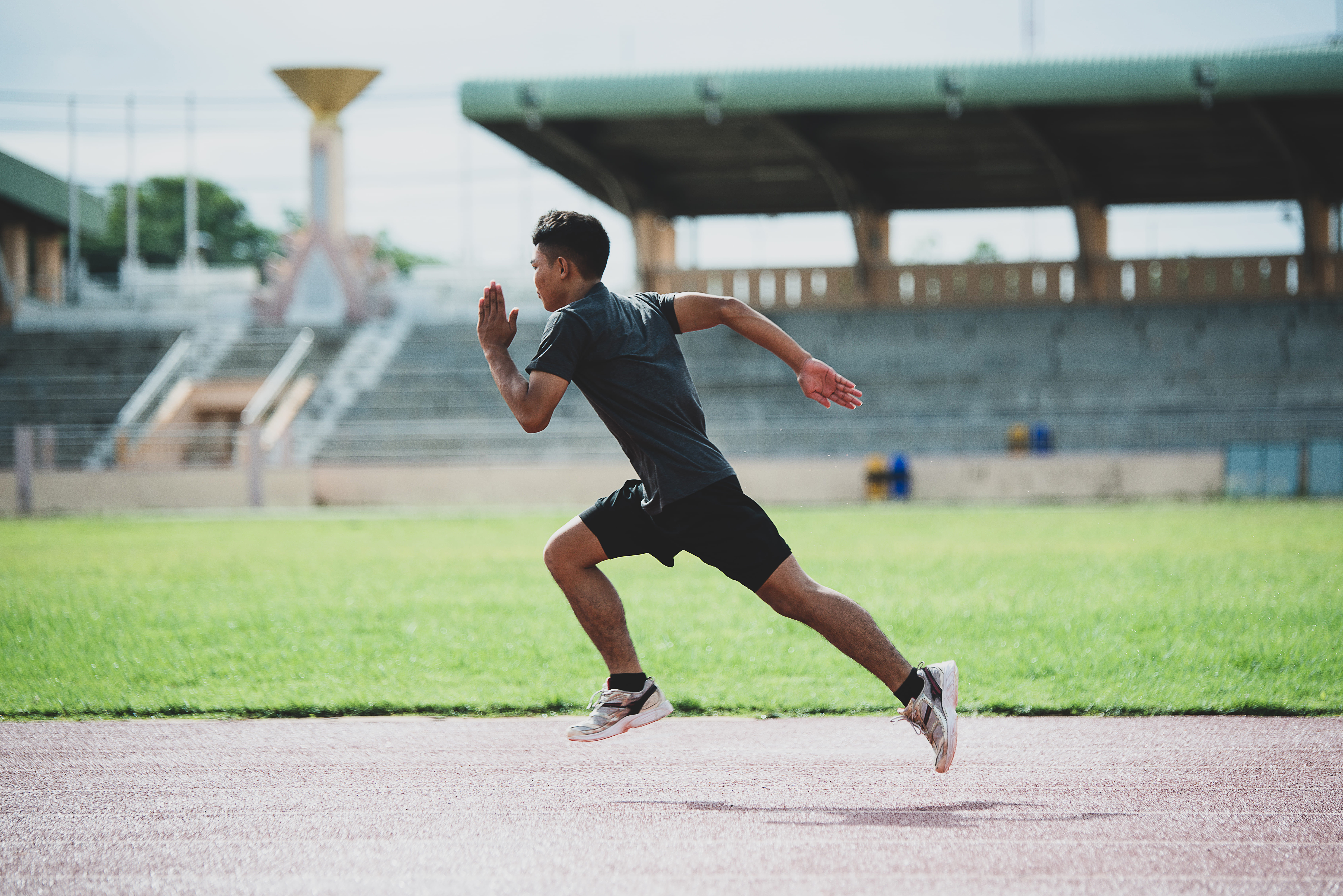 athlete-standing-all-weather-running-tra ck