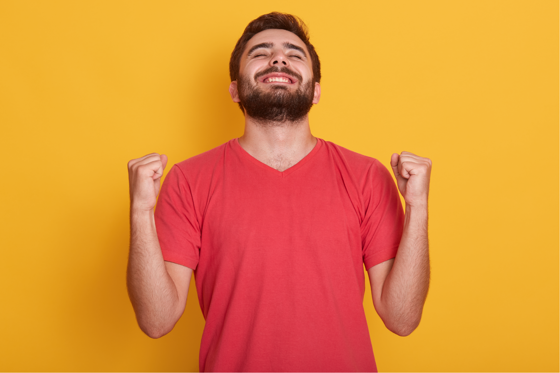 happy-positive-excited-young-male-clenching-fists-screaming-wearing-red-casual-t-shirt-having-good-news-celebrating-his-victory-success-wins-lottery-people-emotions-concept-01